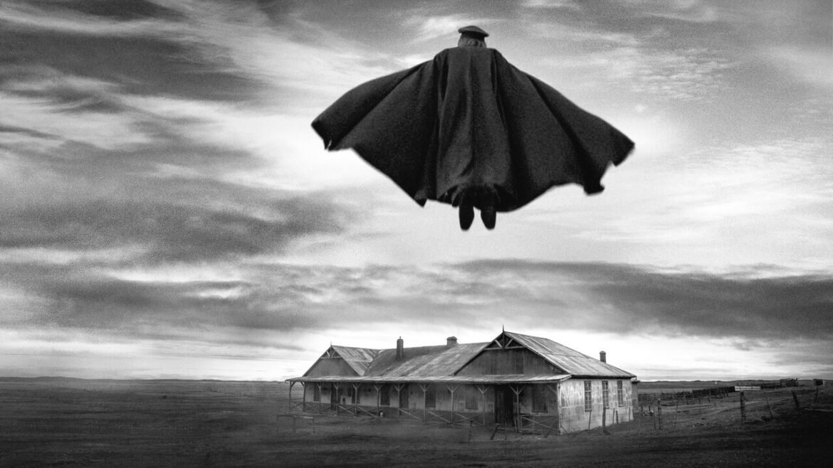 Pinoquet flies above a house - a scene from the film El Conde by Pablo Larrain